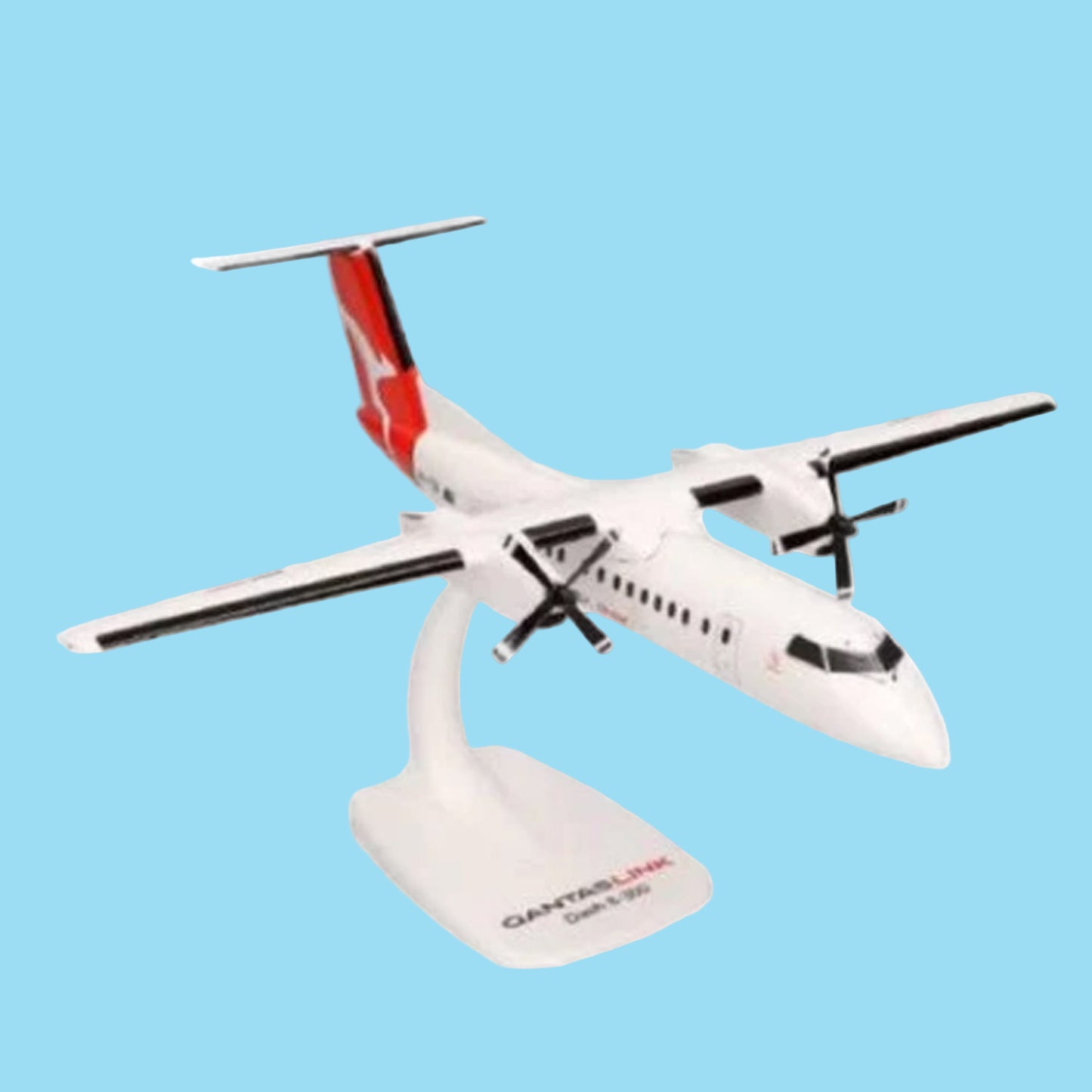 Celebrate regional aviation excellence with this charming 1/100 scale Dash 8-300 from PPC, featuring the QantasLink livery. This meticulously detailed collectible showcases the reliable turboprop that connects Australia's regional communities with style and efficiency. www.defenceqstore.com.au