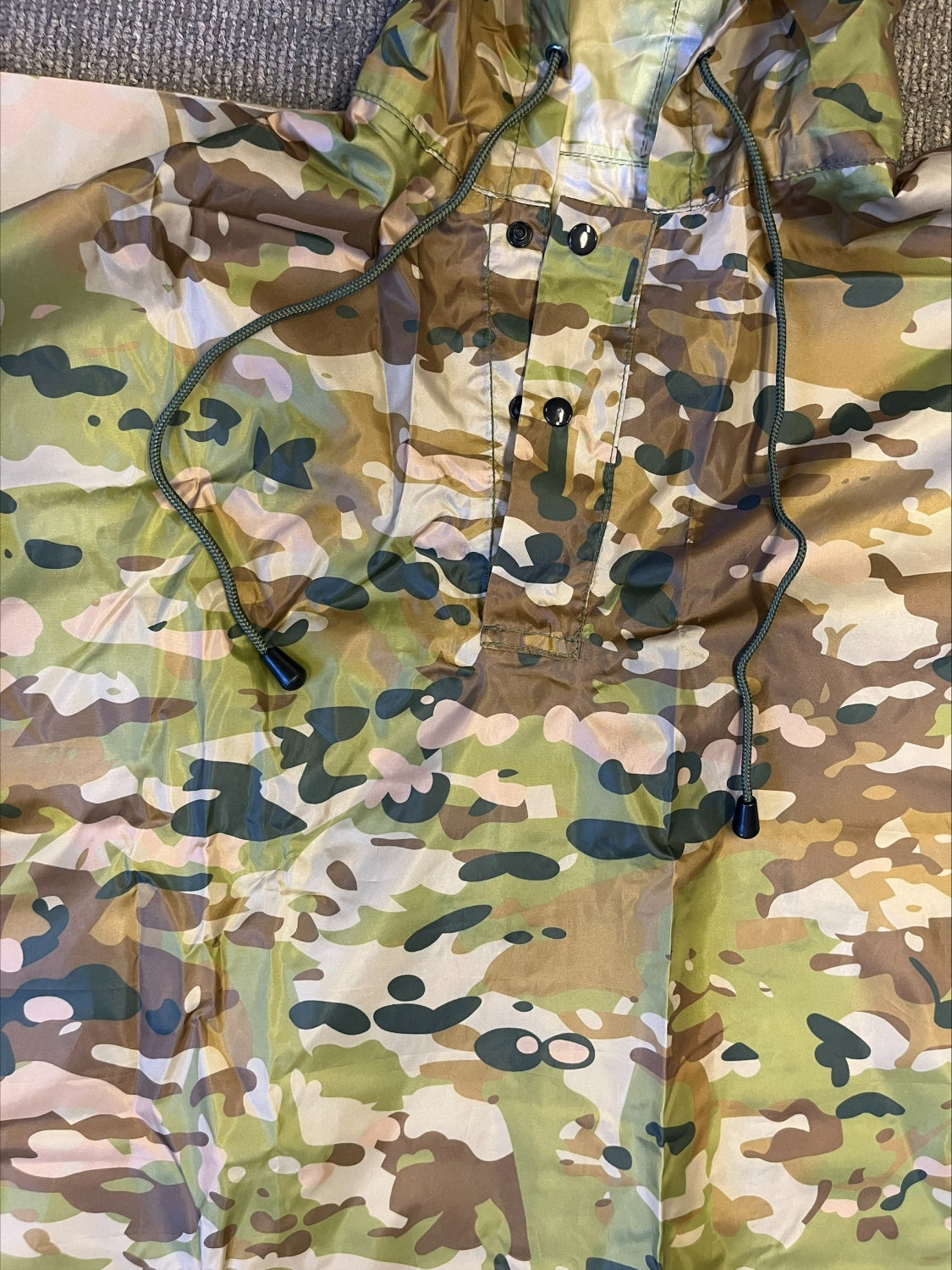 Stay protected from the elements with the Army Cadet Australian Multicam Poncho—your essential companion for any outdoor adventure. This versatile poncho shields you and your gear from heavy rain during camping, hiking, fishing, and military training. www.defenceqstore.com.au