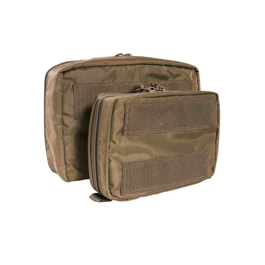 Organize your medical essentials with the Tasmanian Tiger Medic Pouch Set VL in Coyote Brown. This versatile two-piece system features transparent construction for quick identification of contents, paired with robust hook-and-loop attachment for seamless modular integration into your gear setup. www.defenceqstore.com.au