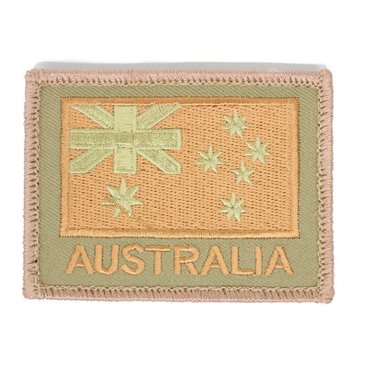 The Australia Flag Tan On Khaki Embroidery Velcro Backed Patch features our embroidery style Australian National flag on a stylish khaki background, complete with the inspiring word "AUSTRALIA" underneath. Measuring 75 x 55mm, this patch is the perfect way to show your love for Australia in a subtle yet powerful way. www.defenceqstore.com.au
