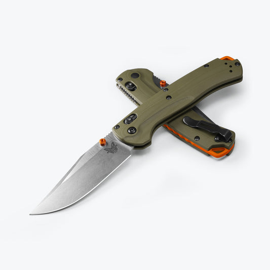 Make the leap from hunt carry to everyday carry.. By popular request, Benchmade's 15536 Taggedout®️ subtly reconfigures this hunt optimised folder into a multi-role outdoor EDC. Replacing the thumb hole with an orange anodised thumbstud and bearing an orange anodised lanyard backspacer, this new Taggedout®️ also trades in the featherweight Grivory®️ handle for OD Green G10. www.defenceqstore.com.au