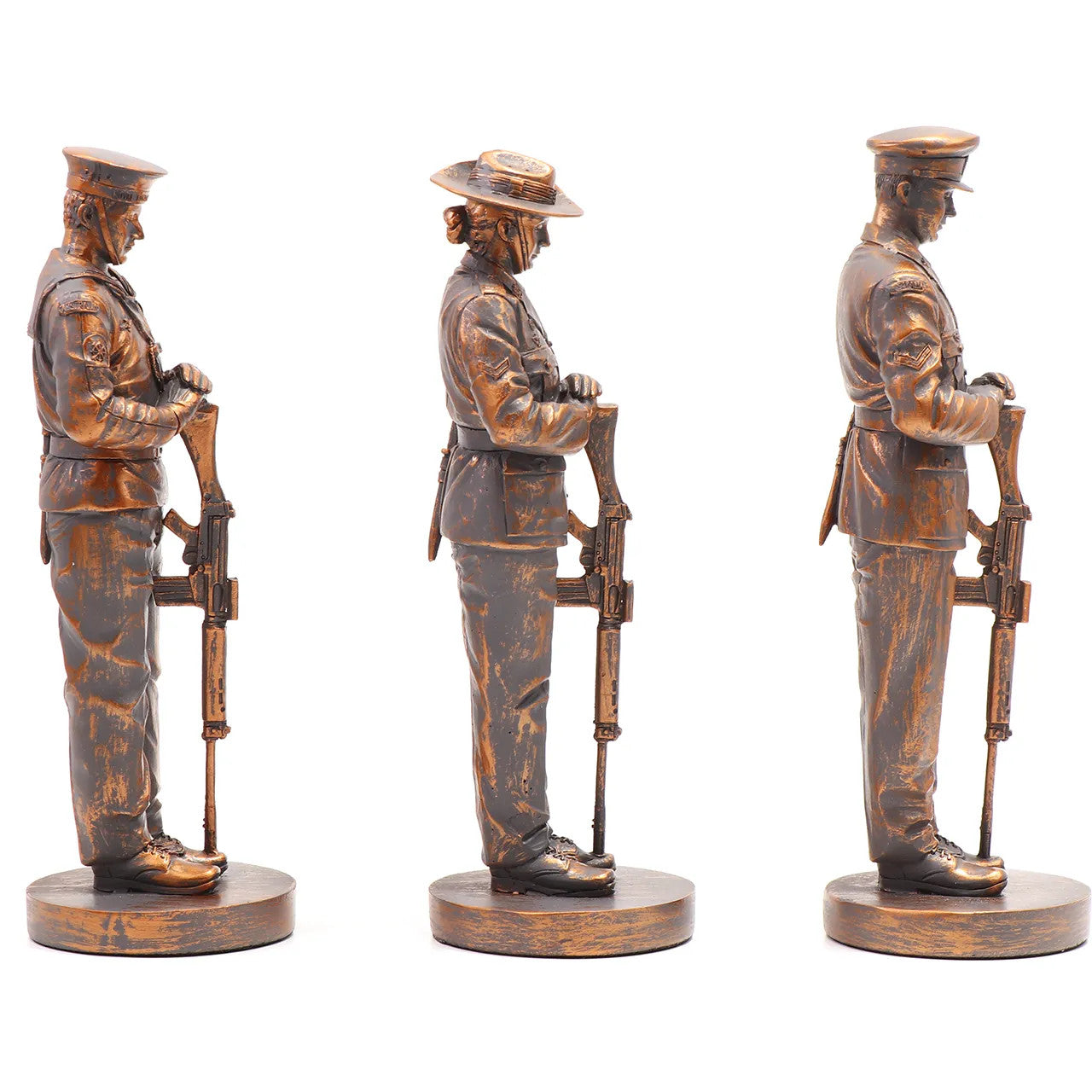 This stunning Courage, Honour, Sacrifice: We Will Remember Them* figurine is a remarkable tribute, crafted with exquisite attention to detail. The figurines, made from cold cast bronze, beautifully depict personnel from the Royal Australian Navy, Australian Army, and Royal Australian Air Force, all captured in a solemn Resting on Reversed Arms stance. www.defenceqstore.com.au