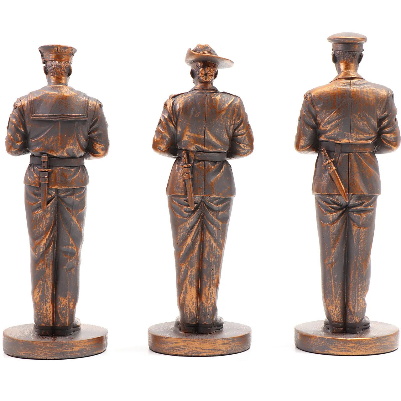 This stunning Courage, Honour, Sacrifice: We Will Remember Them* figurine is a remarkable tribute, crafted with exquisite attention to detail. The figurines, made from cold cast bronze, beautifully depict personnel from the Royal Australian Navy, Australian Army, and Royal Australian Air Force, all captured in a solemn Resting on Reversed Arms stance. www.defenceqstore.com.au