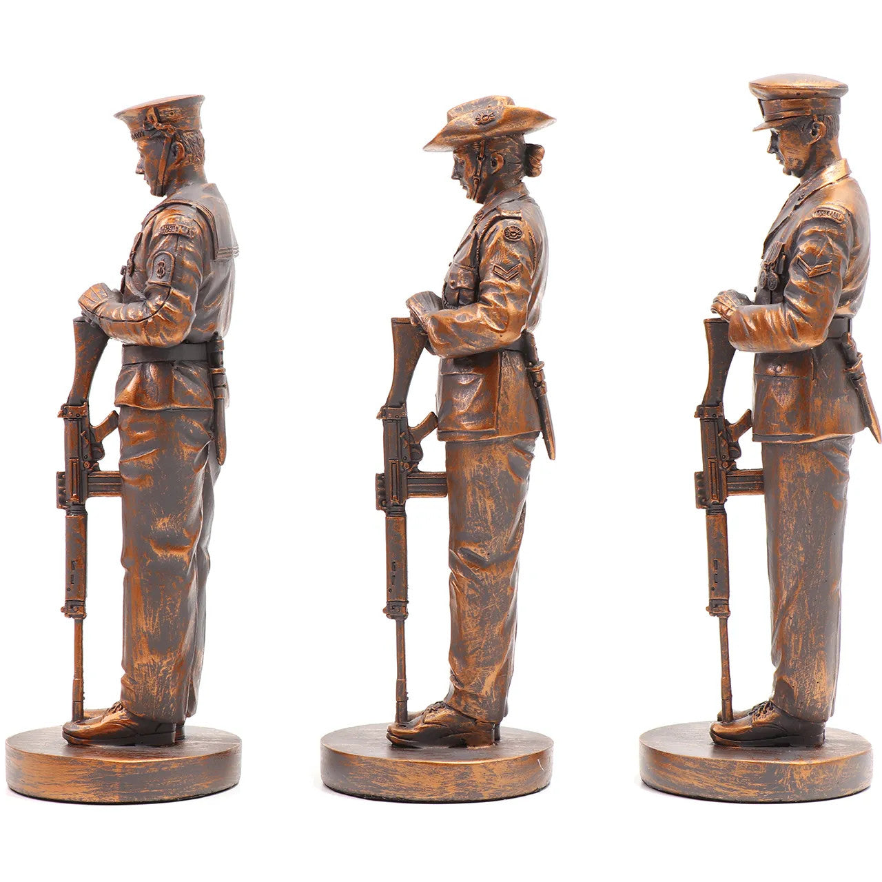 This stunning Courage, Honour, Sacrifice: We Will Remember Them* figurine is a remarkable tribute, crafted with exquisite attention to detail. The figurines, made from cold cast bronze, beautifully depict personnel from the Royal Australian Navy, Australian Army, and Royal Australian Air Force, all captured in a solemn Resting on Reversed Arms stance. www.defenceqstore.com.au