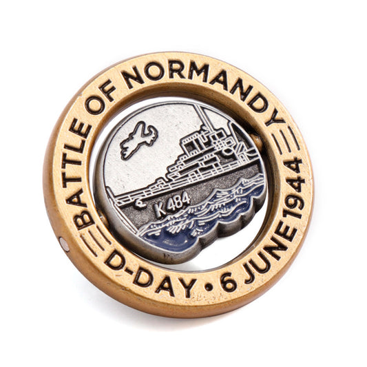 Introducing our exclusive D-Day - Battle of Normandy limited-edition lapel pin, a true collector's item with only 1000 individually numbered pins. This meticulously crafted pin features a unique spinning disc on an axel, allowing the wearer to alter the front-facing image at their discretion. www.defenceqstore.com.au
