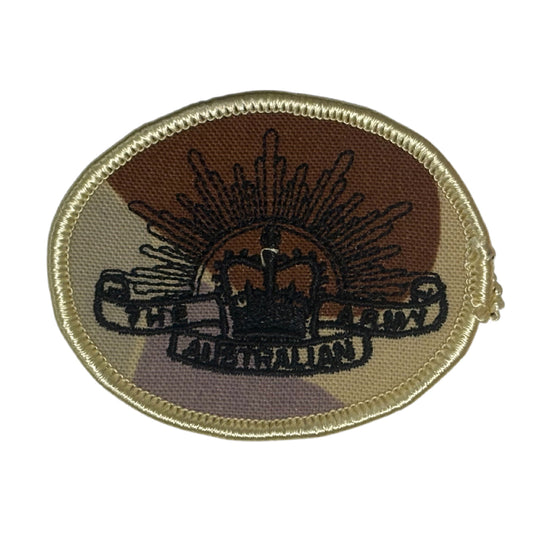 This DPDU Australian Army Rising Sun Biscuit Shoulder Patch, sized at 6.5cm by 4.7cm, features a plain backing that ensures easy application on uniforms, providing a subtle yet authentic military touch. www.defenceqstore.com.au