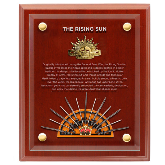 This beautifully crafted timber plaque features a mounted version of the seventh iteration of the iconic Rising Sun Hat Badge, accompanied by a small replica of the Hutton Trophy of Arms, the revered symbol believed to have inspired the design of the Rising Sun Badge. At the front of the plaque, a clear acrylic panel is engraved with a brief history of the Rising Sun, offering a thoughtful narrative behind this powerful emblem. www.defenceqstore.com.au
