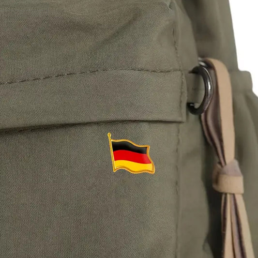 This gold-plated, enamel-filled lapel pin allows you to proudly display the German flag while honouring all those who have served or are currently serving in all theatres of war and peacekeeping efforts. Featuring the German Flag, it symbolises both national pride and remembrance. www.defenceqstore.com.au