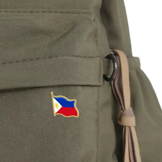 This gold-plated, enamel-filled lapel pin allows you to proudly display the Philippines flag while honouring all those who have served or are currently serving in all theatres of war and peacekeeping efforts. Featuring the Philippines Flag, it symbolises both national pride and remembrance. www.defenceqstore.com.au