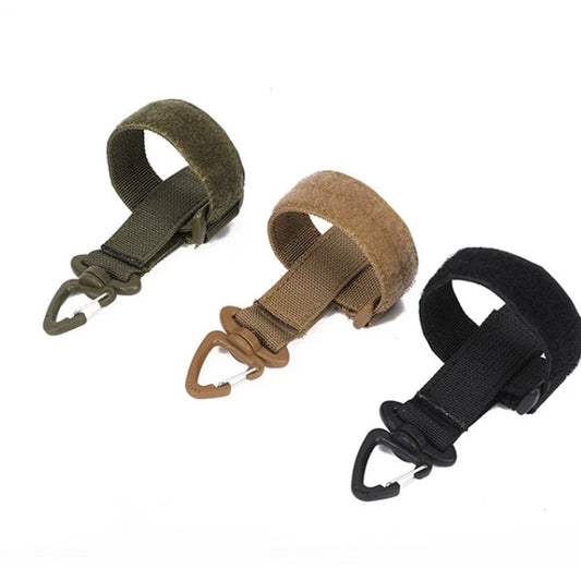 Experience superior strength and reliability with our Tactical Key & Gloves Holder MOLLE Webbing, crafted from high-quality nylon and reinforced with tight, durable stitching. The carabiner hook keychain securely attaches to casual and tactical belts up to two inches wide, giving quick access to all your necessary keys and accessories. www.defenceqstore.com.au