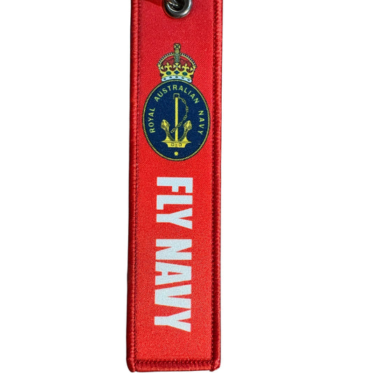 Keep your keys secure and add a touch of military pride with this authentic Navy Key Tag. Featuring bold embroidered Navy insignia and the iconic "Remove Before Flight" wording, it's a practical accessory that makes a statement. www.defenceqstore.com.au