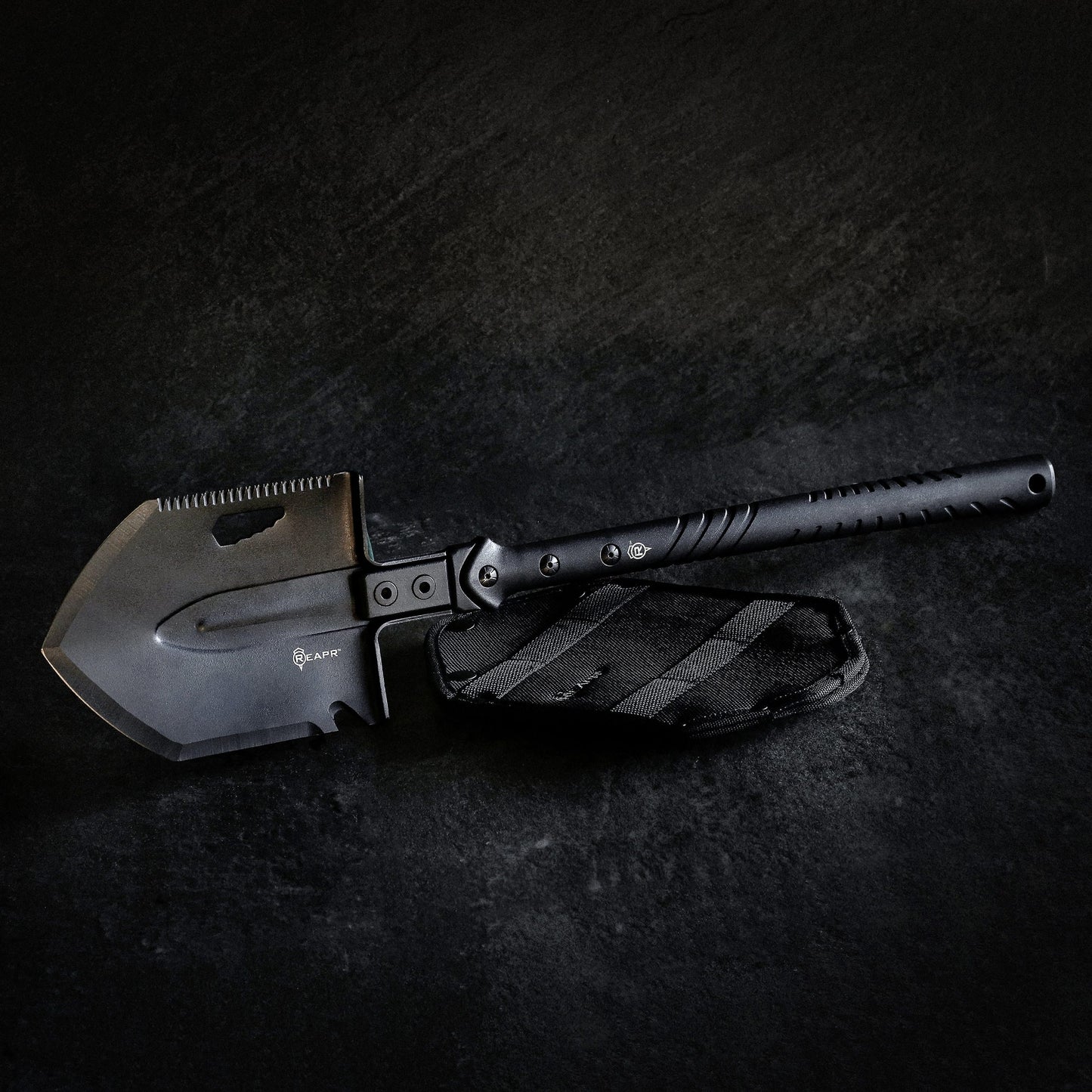 The REAPR 11021 TAC Survival Shovel is the ultimate survival tool shovel. This compact, space saving tool, features a 7 1/2″ stainless steel precision cast head (with a powder coat wrinkle finish) combining a saw edge, ripper, chopping edge and wrenches. www.defenceqstore.com.au