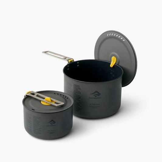 The Frontier Ultralight Two Pot Set includes a compact 1.3L and generously-sized 3L pot made of high quality hard-anodised aluminium alloy for durability and efficient heat transfer. Elevate your cooking experience with a ceramic non-stick coating, clever strainer holes in the pot lid, and a Lid Keep that allows you to clip the lid to the side of the pot to free up a hand for stirring or seasoning. www.defenceqstore.com.au