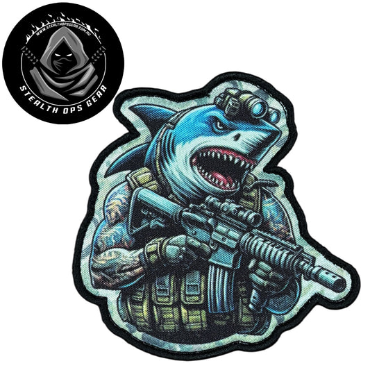 Unleash your creativity with the Shark Assault Embroidery Patch Hook & Loop Stealth Ops Gear! Measuring 9x8.8cm and featuring a beautifully embroidered design and secure hook & loop backing, this patch is a must-have for any collector. www.defenceqstore.com.au