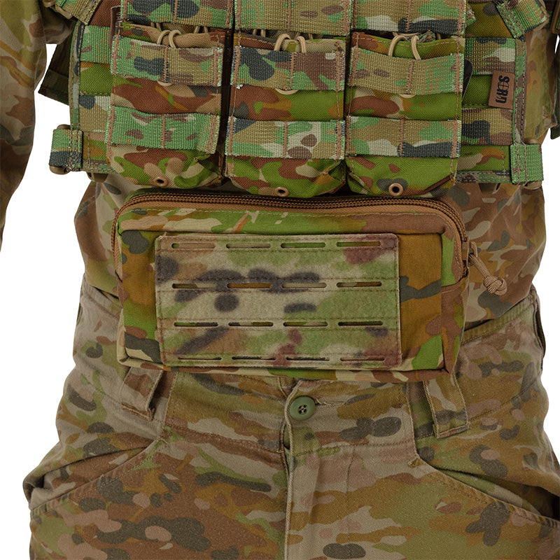 This versatile Tactical Vest Hanging Pouch AMCU serves multiple purposes - from carrying medical supplies, navigation essentials, to stowing general gear. Despite its compact size, it offers ample storage space. It can easily be attached to your vest or chest carrier thanks to its universal sandwich Hook & Loop attachment. www.defenceqstore.com.au
