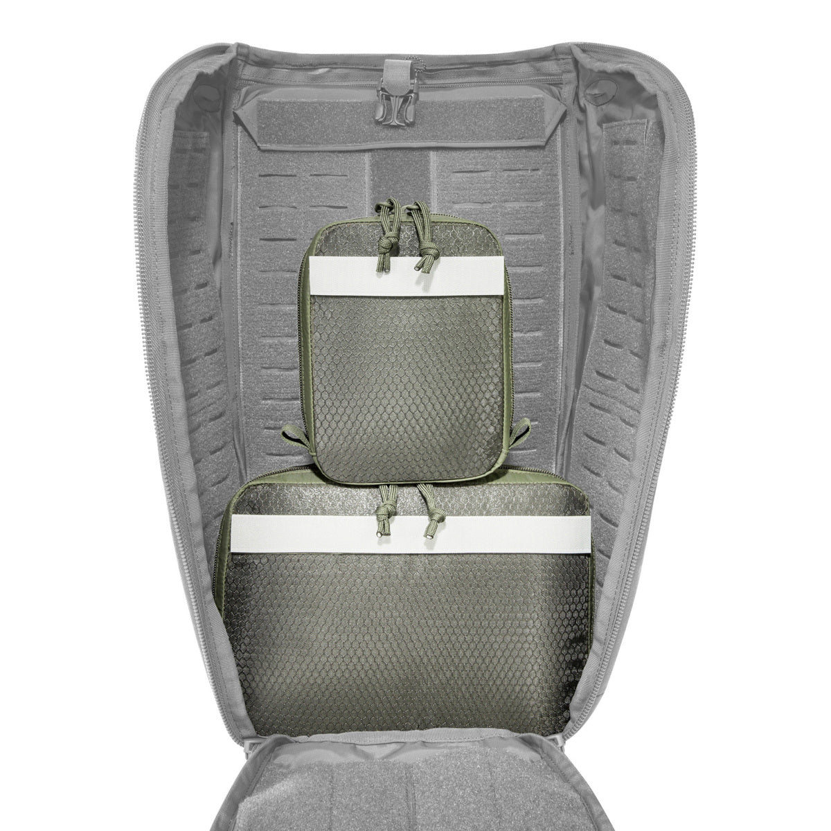 The pouches have a transparent lid made of mesh material and hook-and-loop strips on the back. They can be easily mounted on hook-and-loop surfaces or in the modular TT backpacks. www.defenceqstore.com.au