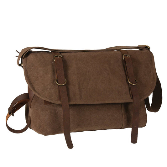 Vintage Canvas Explorer Shoulder Bag Consists Of A Large Main Compartment With 2 Small Pouches And Inner Zippered Pocket, Front Outer Pocket With Hook And Loop Closure, Front Flap With Hook And Loop Closure & Leather Strap Closure, Large Rear Zippered Pocket, Leather Zipper Pulls, And Antique Brass Hardware.