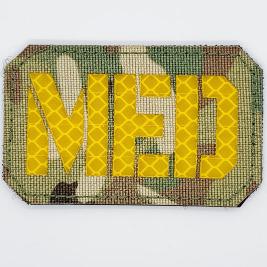 This Medic Reflective Laser Cut Patch is an essential addition to any gear collection! The durable hook and loop backing ensures easy attachment to any surface. Measuring at 8x5cm, this patch is the perfect size for visibility and practicality. Both the hook and loop pieces are provided, making application a breeze. Don't miss out on the value and versatility of this patch! www.defenceqstore.com.au