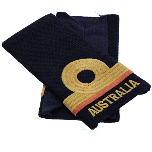 Order this quality Sub Lieutenant Dental Officer Soft Rank Insignia with embroidered detailing this set of two is ready for wear. Order your set now.  Specifications:      Material: Soft rank insignia, fabric, raised embroidery     Colour: Blue, gold, coral     Size: Standard