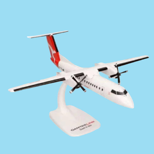 Celebrate regional aviation excellence with this charming 1/100 scale Dash 8-300 from PPC, featuring the QantasLink livery. This meticulously detailed collectible showcases the reliable turboprop that connects Australia's regional communities with style and efficiency. www.defenceqstore.com.au