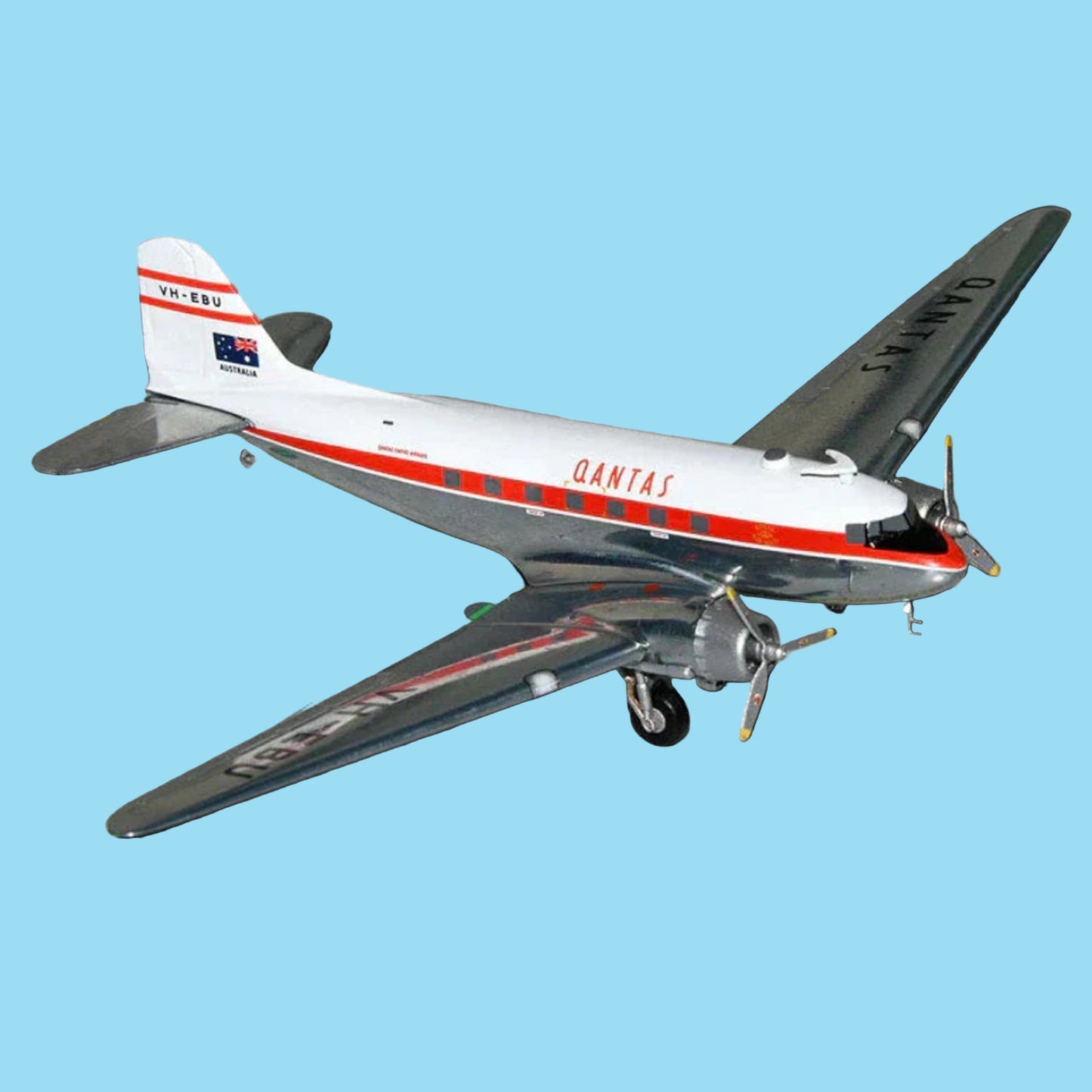 Step back in time with this gleaming 1/200 scale Qantas DC-3 from Gemini Jets, featuring the polished aluminium finish of aircraft VH-EBU. This exquisitely detailed collectible honours the legendary Douglas transport that pioneered commercial aviation in Australia, rendered with authentic period accuracy and lustrous detail. www.defenceqstore.com.au