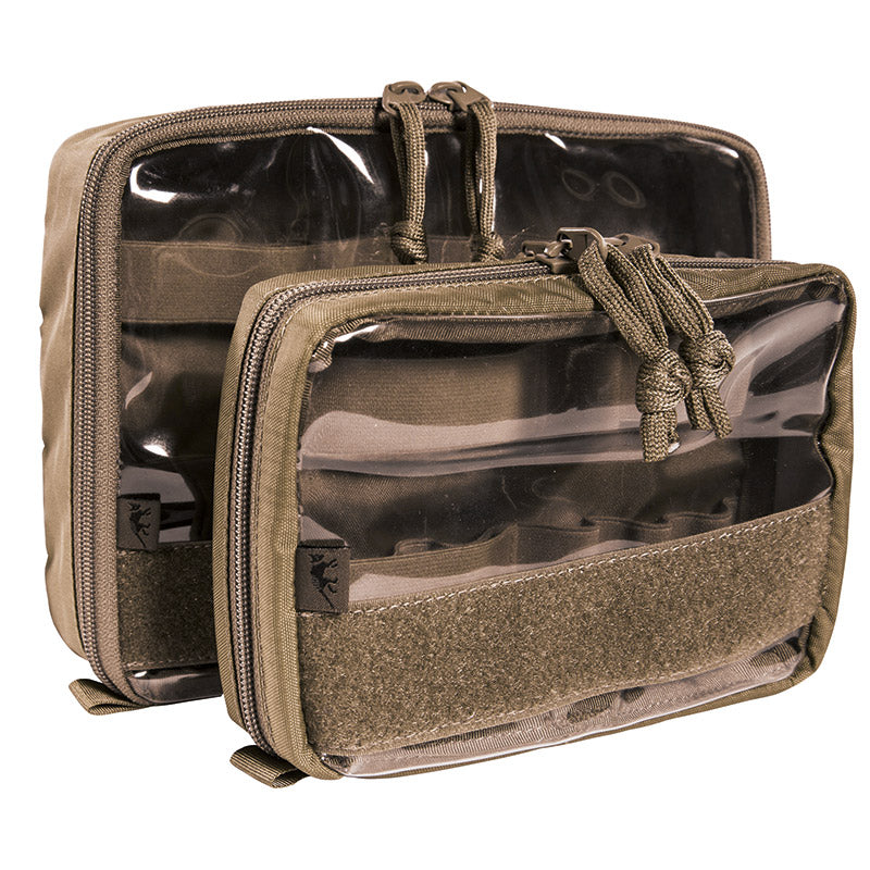 Organize your medical essentials with the Tasmanian Tiger Medic Pouch Set VL in Coyote Brown. This versatile two-piece system features transparent construction for quick identification of contents, paired with robust hook-and-loop attachment for seamless modular integration into your gear setup. www.defenceqstore.com.au