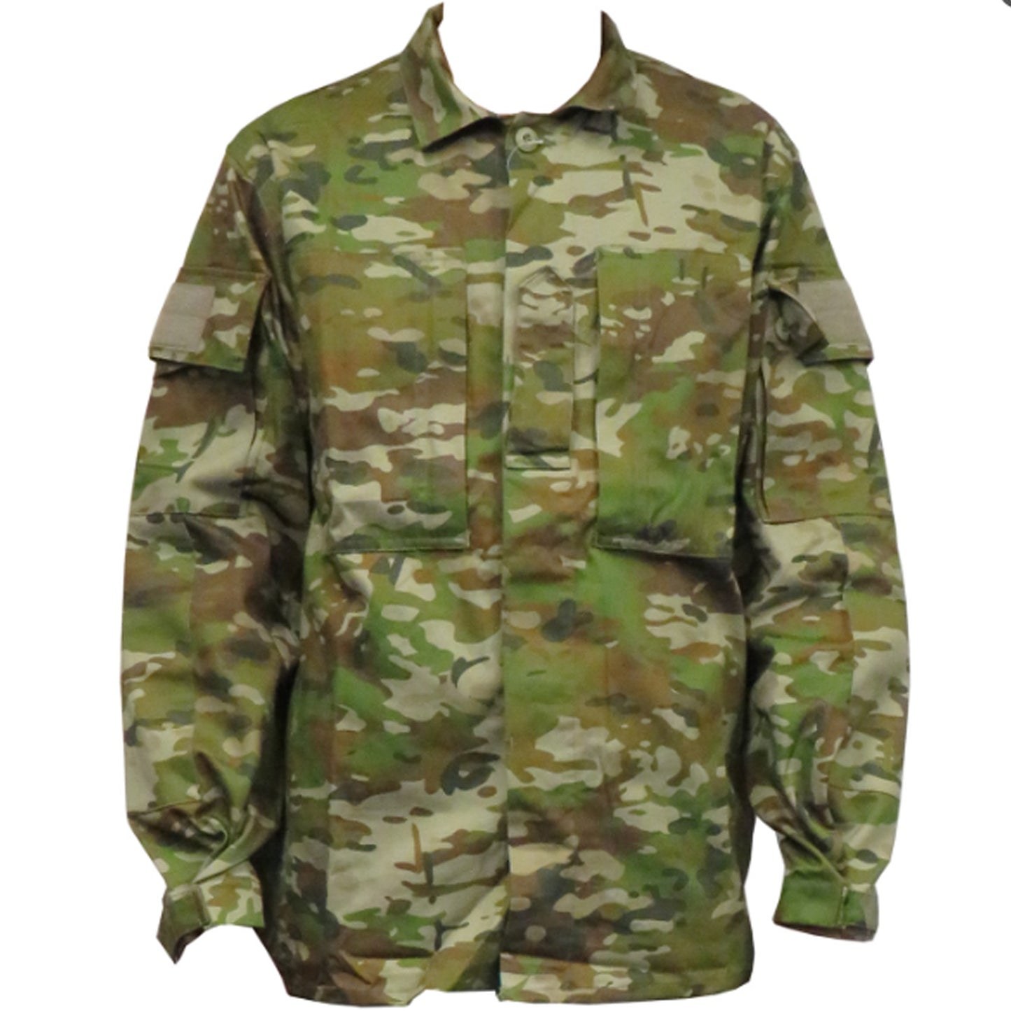 Built for demanding conditions, this TAS Long Sleeve Military Cadet shirt combines authentic Australian Army camouflage with practical performance features. The robust 70% cotton and 30% polyester blend delivers superior breathability without sacrificing durability, while the substantial 270GSM fabric stands up to rigorous wear. www.defenceqstore.com.au