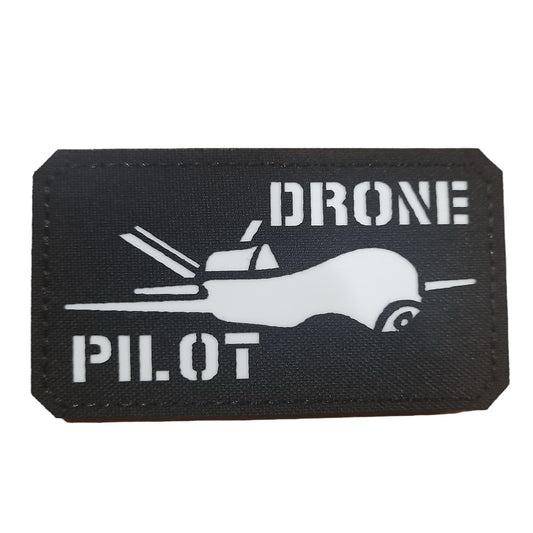 Master your surveillance drone with precision and control as a skilled drone pilot. From takeoff to landing, you have the power to guide the drone and perform necessary tasks with ease. Be responsible for safety tests, monitor performance, and evaluate capabilities of your drone system. Add this glow in the dark 9x5cm laser cut patch to your collection. www.defenceqstore.com.au