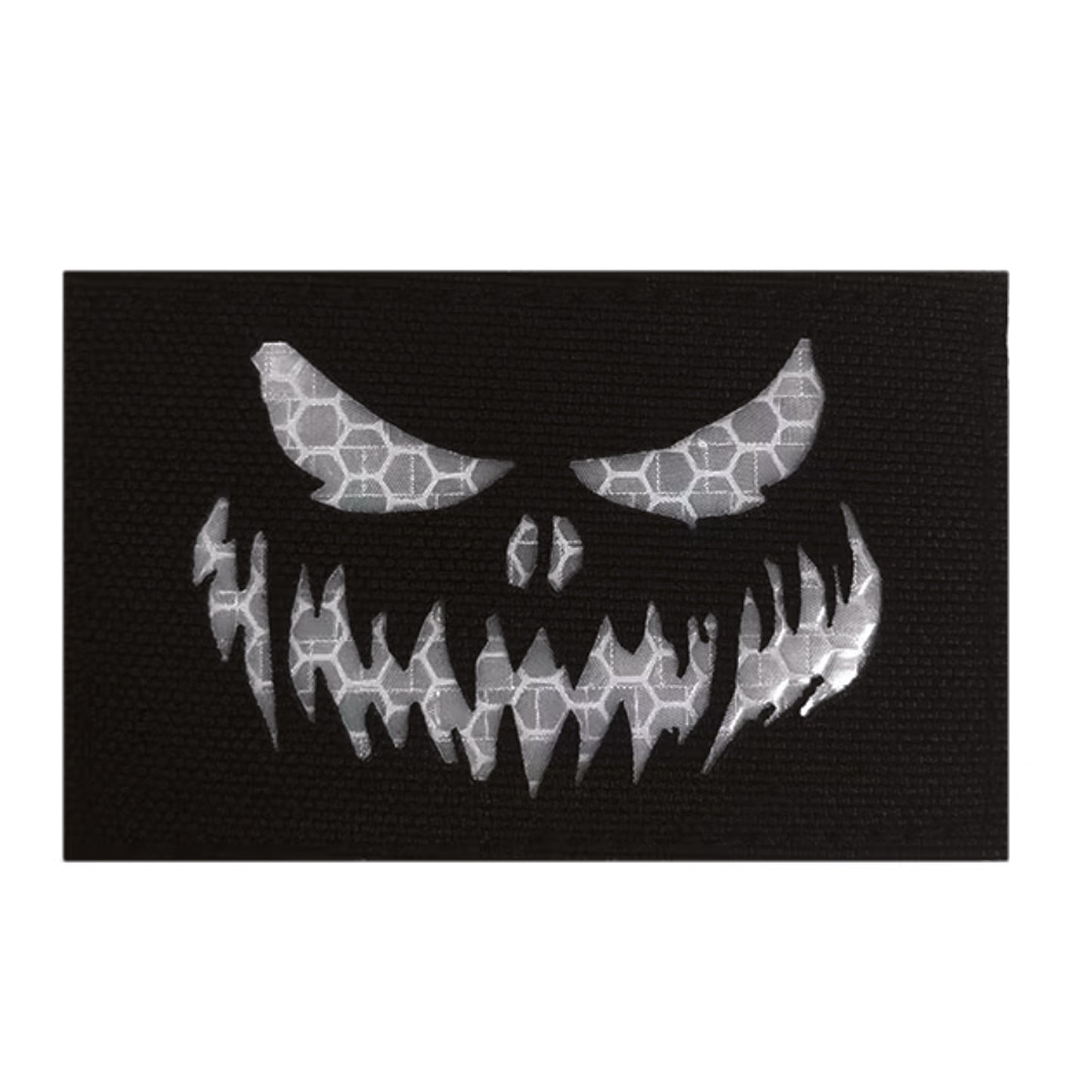 Stand out in low-light conditions with this striking Haunting Laser Cut Reflective Patch Hook &amp; Loop. Precision laser-cut design delivers crisp, detailed edges that catch the eye, while the reflective feature ensures visibility when it matters most.  www.defenceqstore.com.au