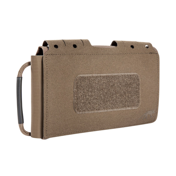 Small, flat IFAK pouch for mounting on MOLLE surfaces or on the belt. The fold-out first aid panel, which can be individually equipped, can be pulled out on both sides. www.defenceqstore.com.au