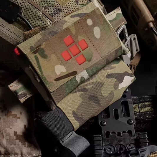 Compact yet comprehensive, this trauma first aid kit pouch combines tactical functionality with practical design. Weighing just 102 grams and measuring 22.5x10cm, it's engineered for rapid response without bulk. www.defenceqstore.com.au