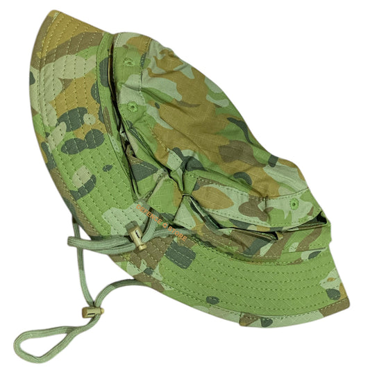 Elevate your outdoor adventures with the Premium Quality AMCU Giggle Bush Hat. Made with breathable fabric and two sturdy drawstrings, this hat is designed for ultimate comfort and functionality. www.defenceqstore.com.au