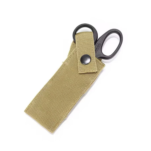 This locally made pouch is designed for tactical vests plus belts and offers a sleek, lightweight, and effective solution. It features a padded sleeve for a single pair of medium sized trauma shears, with an easy access button clip system that can be operated with one hand. The pouch only requires one MOLLE column for attachment, ensuring quick and convenient access to vital tools when every second counts. www.defenceqstore.com.au