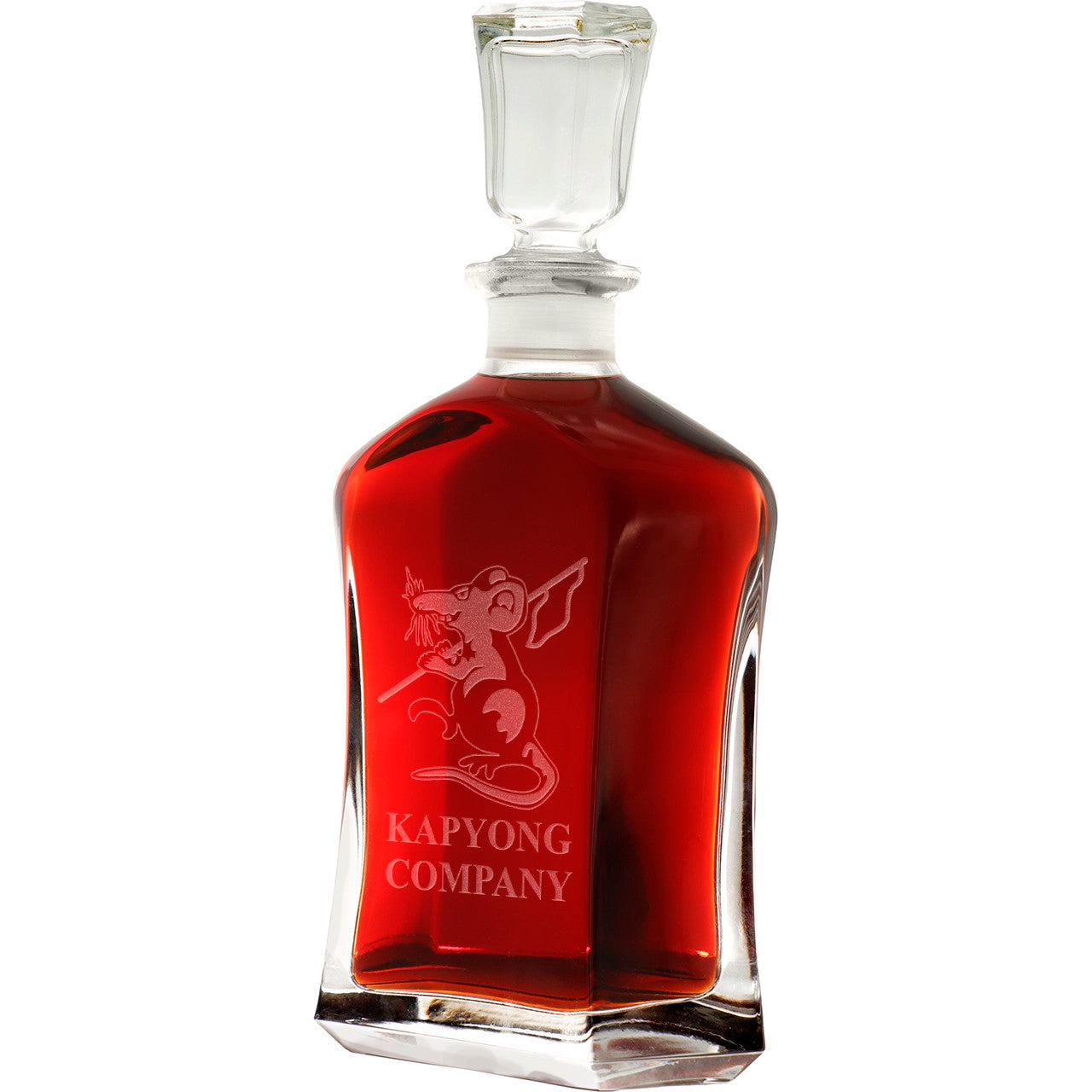 Bring your dining experience to life with the Kapyong&nbsp;Company Italian Glass Decanter. This elegant, 750ml decanter proudly displays the company crest, etched with precision onto the sleek glass surface. Perfect for gifting or displaying in your own cabinet or bar, this decanter is a must-have for any wine or spirit enthusiast. Enhance your evening with the beauty and quality of this stunning piece. www.defenceqstore.com.au