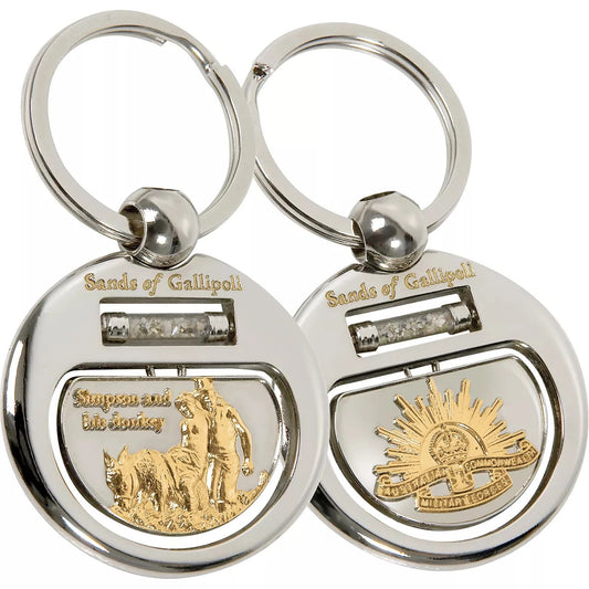 Experience the beauty and history of Gallipoli with our Sands of Gallipoli 07 Key Ring, featuring a sleek two-tone design and authentic sand from the famous beach. The sand flows freely in a cylindrical vial, creating a mesmerizing and meaningful piece. Each time you use your key ring, you'll be reminded of the significance of Gallipoli. www.defenceqstore.com.au