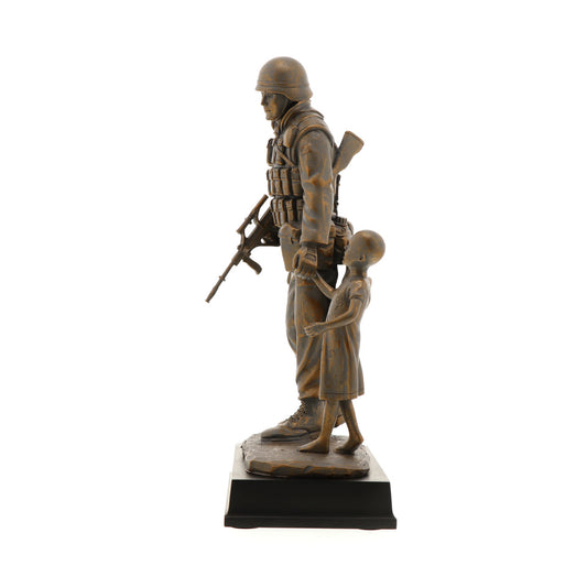 The Somalia Figurine is a sensational keepsake that pays tribute to the brave men and women who served our nation in Somalia. Inspired by Gary Ramage's iconic photograph, this figurine depicts a soldier helping a young girl, symbolizing the spirit of service and humanity. Standing at 30cm tall, this superb figurine is the perfect gift or collectable. www.defenceqstore.com.au
