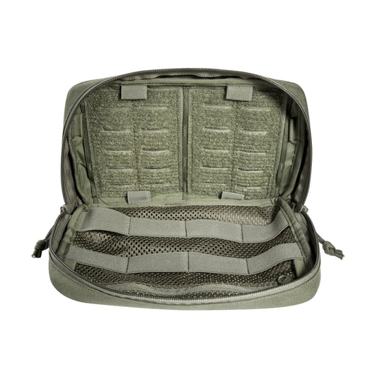 The bag has a removable MOLLE reverse system for attachment to plate carriers and backpacks. In addition, it can be hooked with loops to the TT Survival Pack or other MOLLE surfaces with appropriate buckles. There is also a pass-through for a 50mm belt loop. Inside are flat mesh pockets, elastic loops and a large MOLLE hook-and-loop surface. www.defenceqstore.com.au