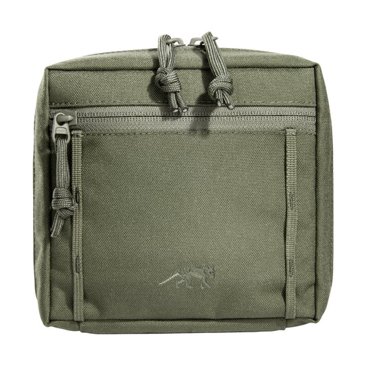 Experience ultimate organization and convenience with the Tasmanian Tiger TAC 5.1 Accessory Pouch in Black. Boasting 15 x 15 x 6 cm dimensions, a spacious opening, and the innovative MOLLE reverse system and hook-and-loop interior, this accessory pouch is the perfect addition to your tactical gear arsenal. Stay prepared and ready for anything with this must-have accessory pouch. www.defenceqstore.com.au