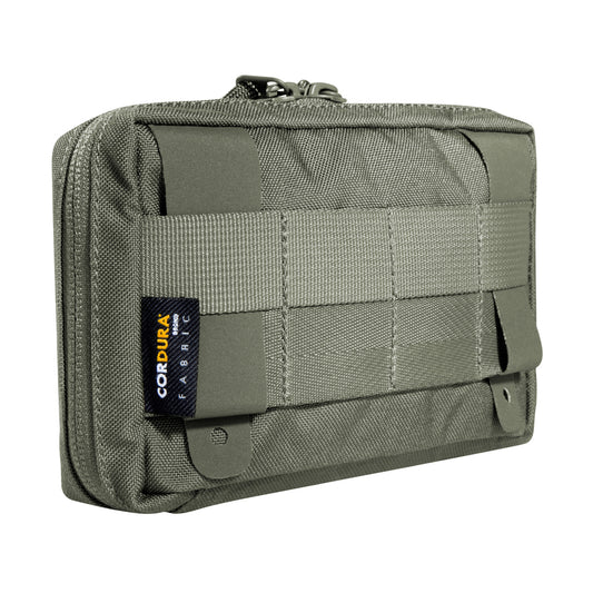 Accessory pouch with 10 x 15 x 4cm dimensions, a large opening and MOLLE reverse system. The inside features are a mesh pocket and elastic loops. www.defenceqstore.com.au