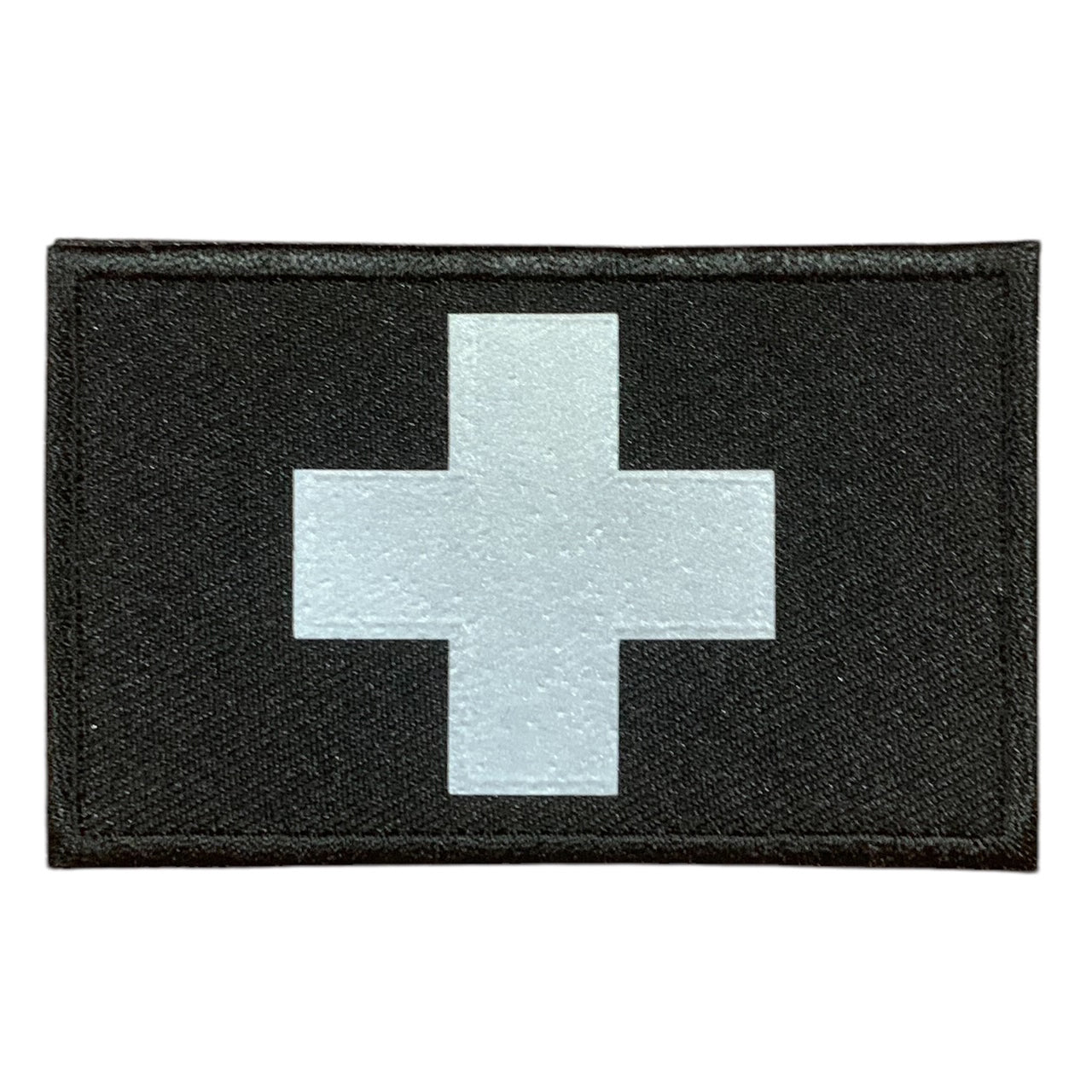 This Medic Reflective Laser Cut Patch is an essential addition to any gear collection! The durable hook and loop backing ensures easy attachment to any surface. Measuring at 8x5cm, this patch is the perfect size for visibility and practicality. Both the hook and loop pieces are provided, making application a breeze. Don't miss out on the value and versatility of this patch! www.defenceqstore.com.au