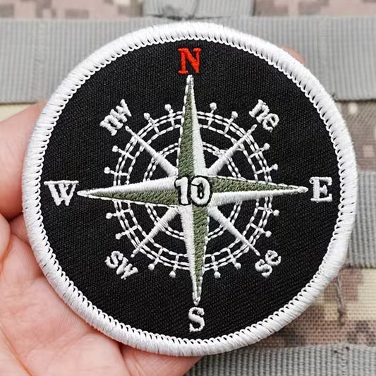 Unleash your creativity with the Compass Black &amp; White Embroidery Patch Hook &amp; Loop! Measuring 7.2cm and featuring a beautifully embroidered design and secure hook &amp; loop backing, this patch is a must-have for any collector. www.defenceqstore.com.au