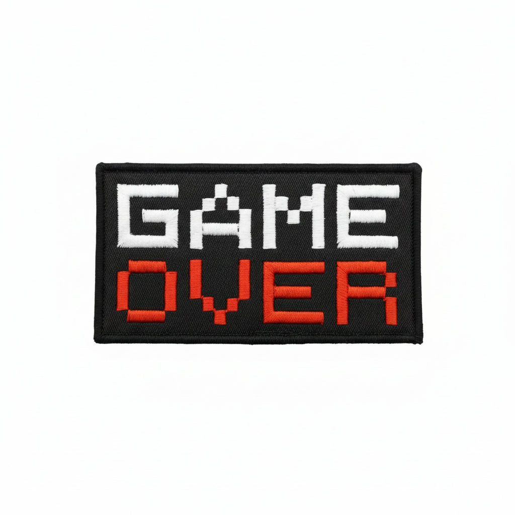 Dominate your gear with this striking Game Over Large Embroidery Morale Patch Hook &amp; Loop&nbsp;, engineered for serious operators. Measuring 10.1x5.1cm, it features dual-sided hook and loop backing—both included—so you can attach it securely to tactical vests, bags, or uniforms and reposition as needed. Built tough for the field, this patch delivers attitude and functionality in one compact package. www.defenceqstore.com.au