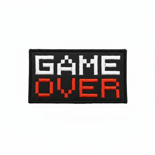 Dominate your gear with this striking Game Over Large Embroidery Morale Patch Hook &amp; Loop&nbsp;, engineered for serious operators. Measuring 10.1x5.1cm, it features dual-sided hook and loop backing—both included—so you can attach it securely to tactical vests, bags, or uniforms and reposition as needed. Built tough for the field, this patch delivers attitude and functionality in one compact package. www.defenceqstore.com.au