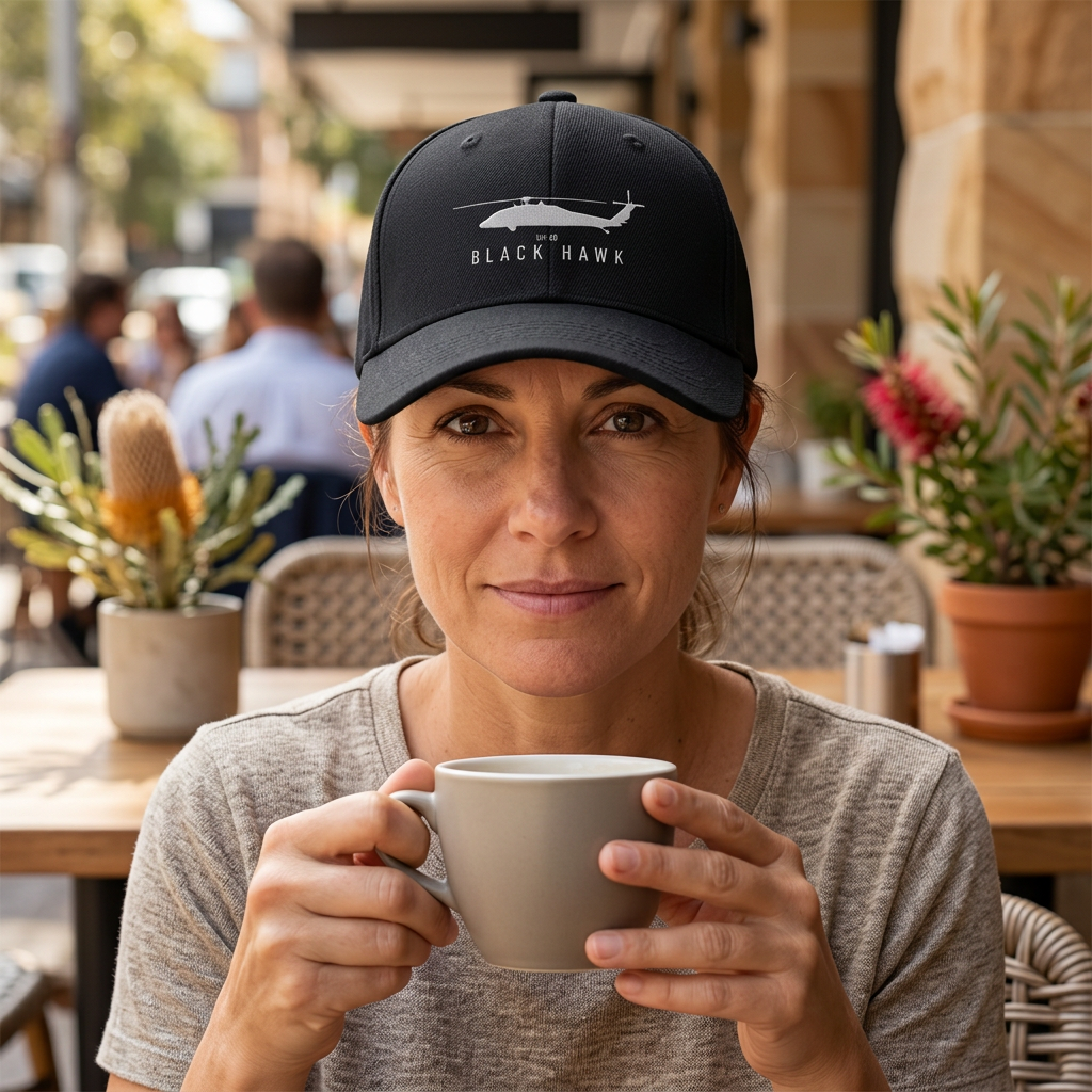 Illustrative Black Hawk UH-60 black cap worn at an outdoor cafe