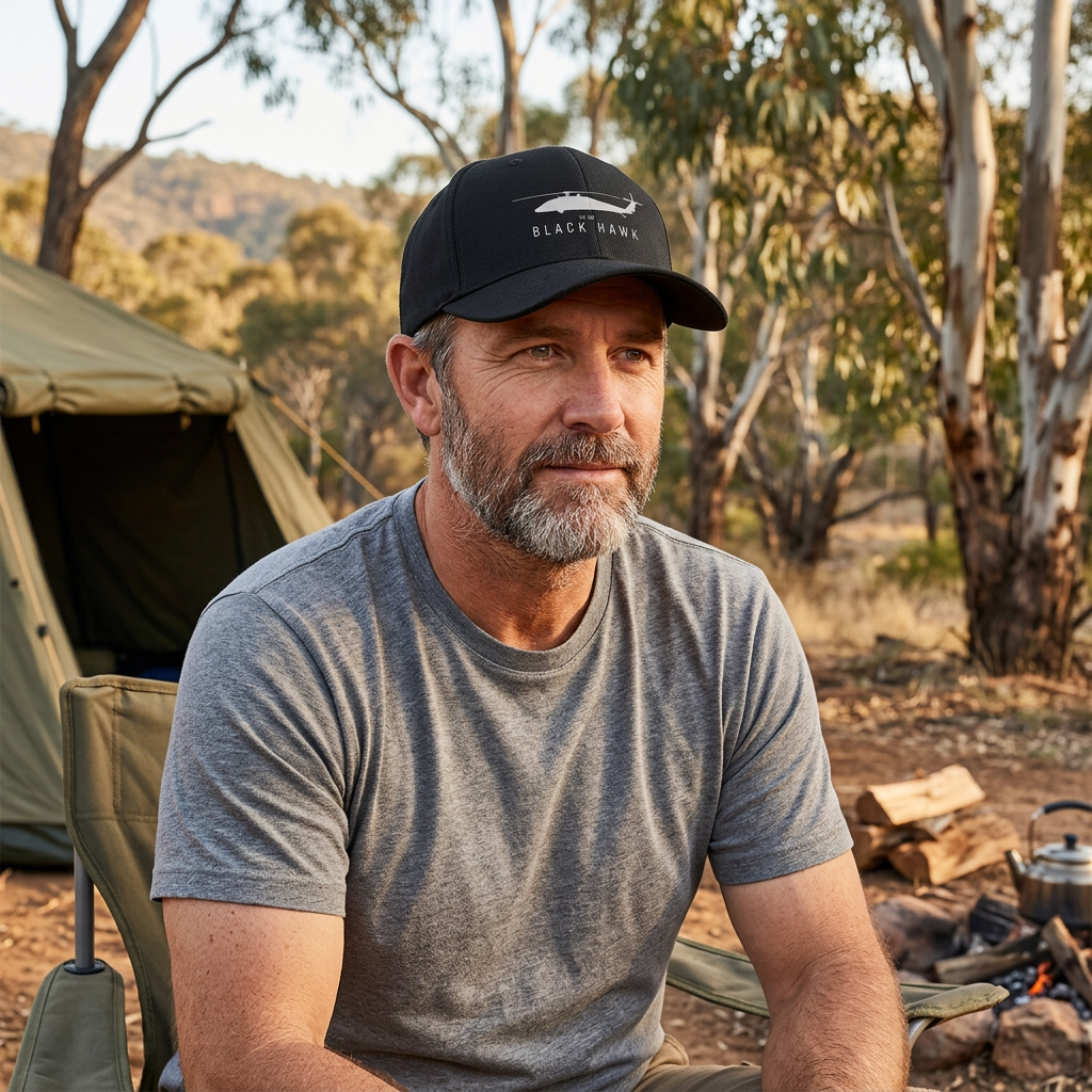 Illustrative Black Hawk UH-60 black cap worn at a bush campsite