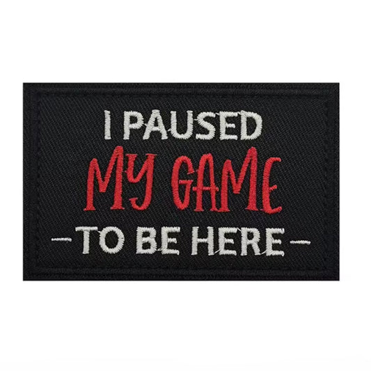 Unleash your attitude with the I Paused My Game To Be Here Embroidery Patch Hook &amp; Loop Featuring an embroidered design and hook &amp; loop backing, this 8x5cm patch is the perfect addition to your collection. Show off your unapologetic confidence and unique sense of humour with this high-quality product. www.defenceqstore.com.au