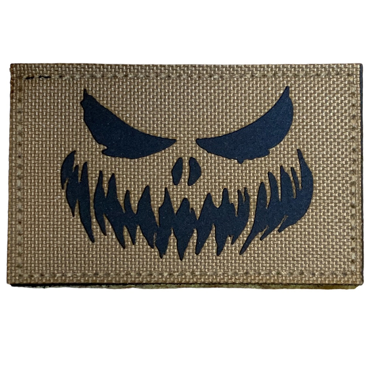 Haunting Laser Cut Tan Patch Hook & Loop.   Size: 8x5cm  HOOK AND LOOP BACKED PATCH(BOTH PROVIDED) www.defenceqstore.com.au