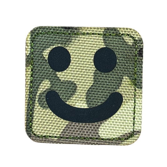 Make a bold statement with the Smiley Laser Cut Multicam Patch. This striking 5x5cm patch features laser-cut precision detailing that demands attention. Backed with both hook and loop fasteners, it's ready to attach to tactical gear, backpacks, or uniforms instantly.  www.defenceqstore.com.au