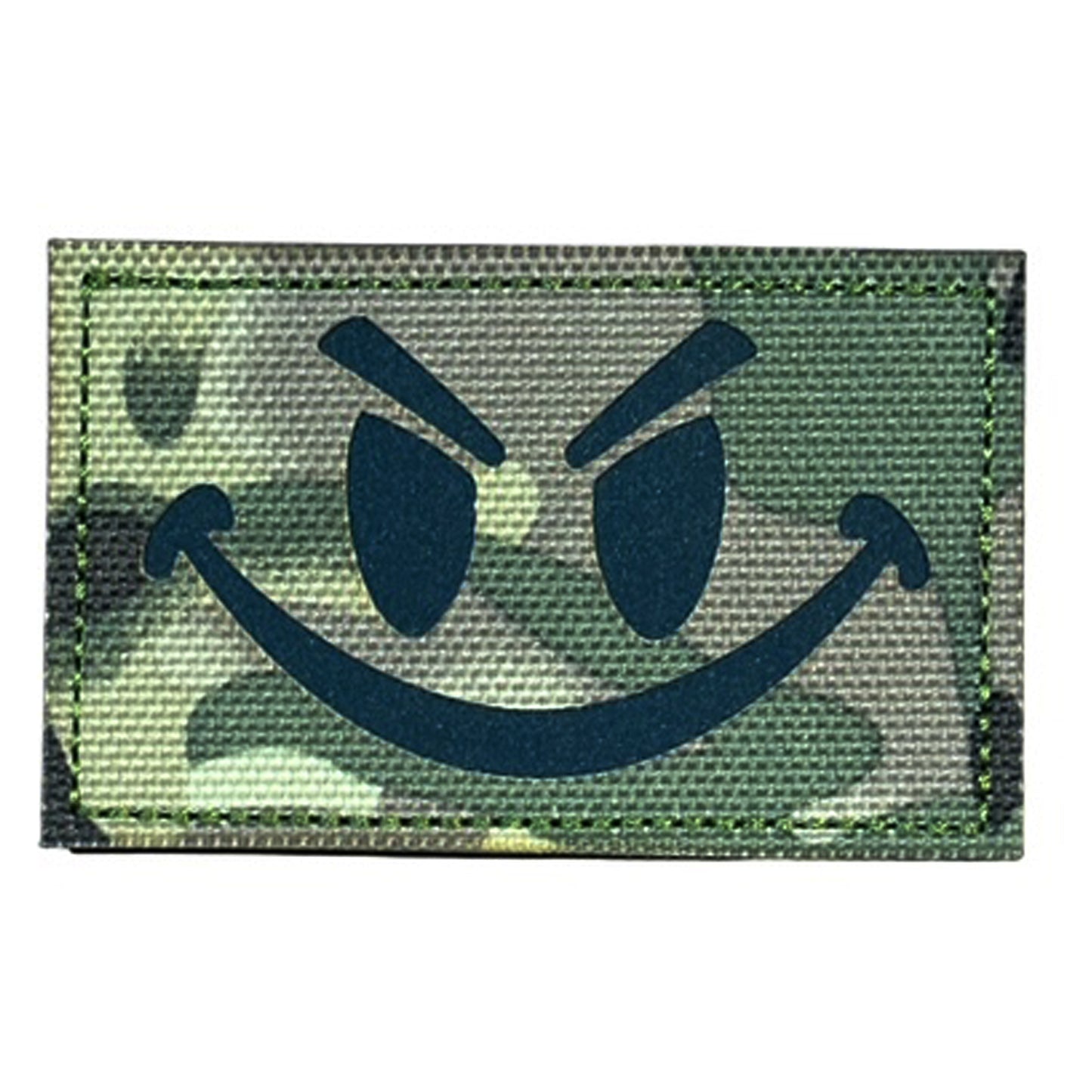 Make a bold statement with the Evil Smile Laser Cut Multicam Patch. This striking 8x5cm patch features laser-cut precision detailing that demands attention. Backed with both hook and loop fasteners, it's ready to attach to tactical gear, backpacks, or uniforms instantly. www.defenceqstore.com.au