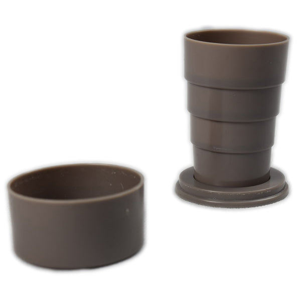 Constructed out of several hard plastic rings that form a small collapsible travel cup that fits about 150ml.  Comes with a cover that can also be used as a small cup.  Colour: Grey beige